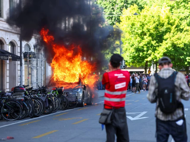 Protesters set Tesla ablaze, smash UN office’s windows in Geneva anti-G7 march
